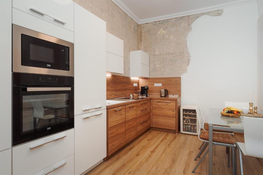 Kuchyň nebo kuchyňský kout v ubytování Apartmán Měšťanský dům