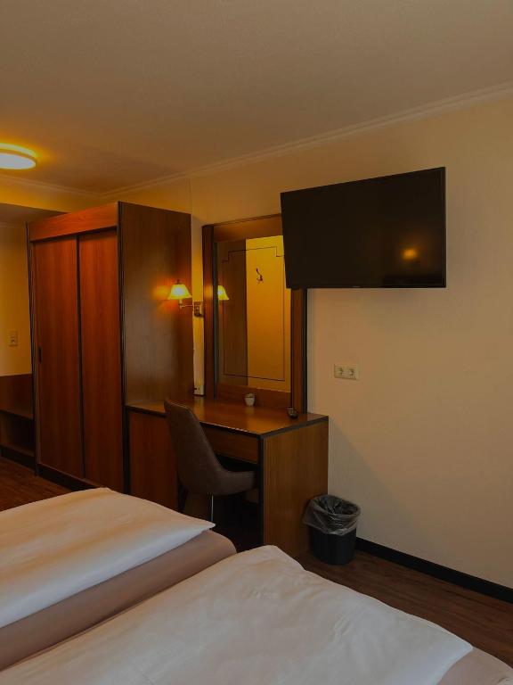 Postel nebo postele na pokoji v ubytování Hotel Rebstock