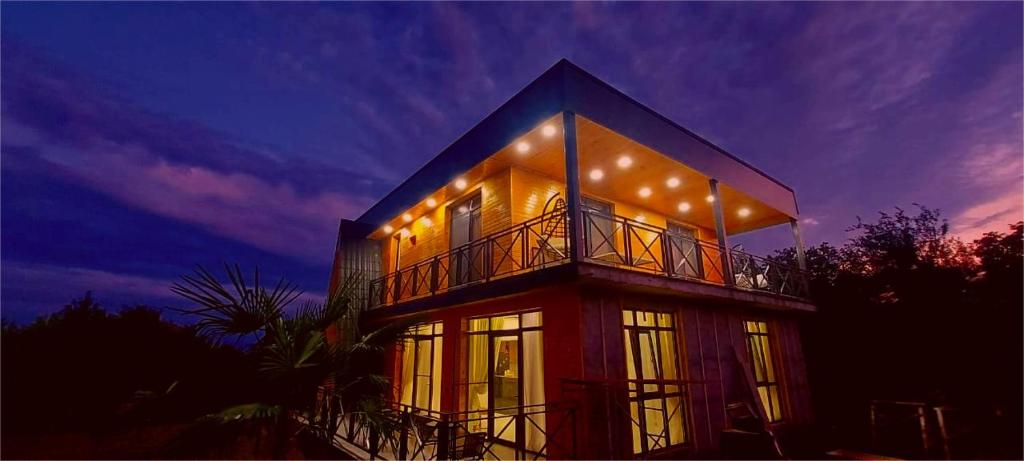 a house with lights on top of it at night at Villa Gio Kvareli in Kvareli