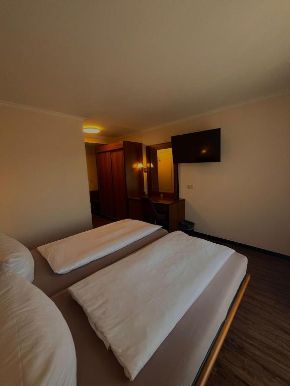 Postel nebo postele na pokoji v ubytování Hotel Rebstock