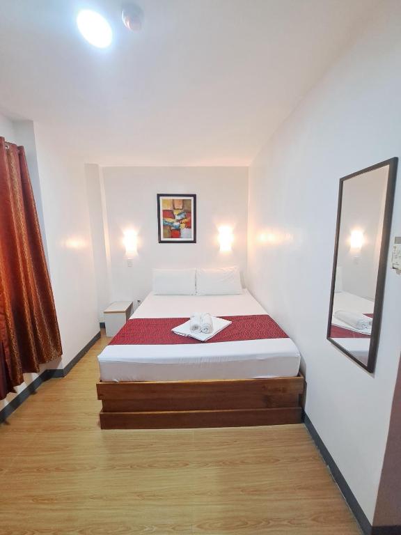 Postel nebo postele na pokoji v ubytování Virginia Suites