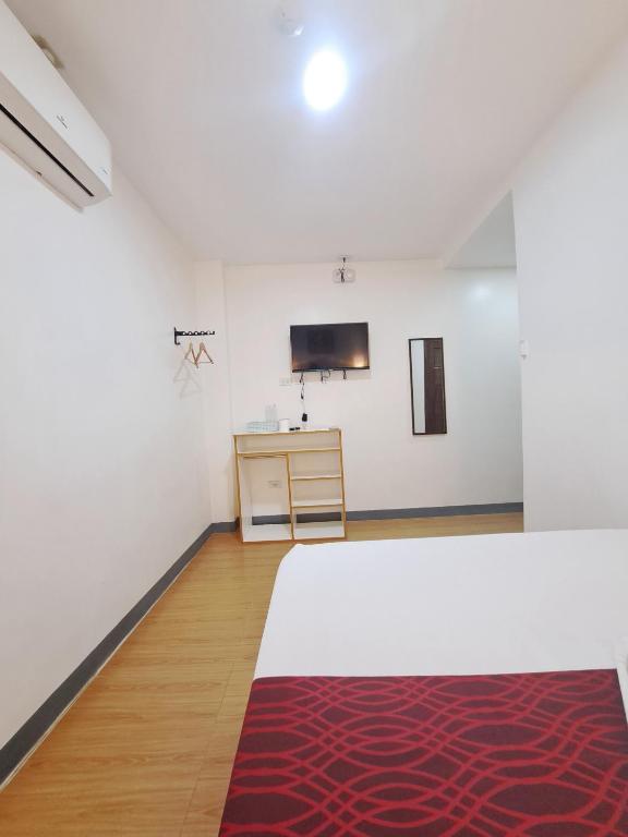 Postel nebo postele na pokoji v ubytování Virginia Suites