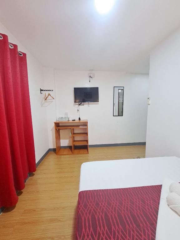 Postel nebo postele na pokoji v ubytování Virginia Suites