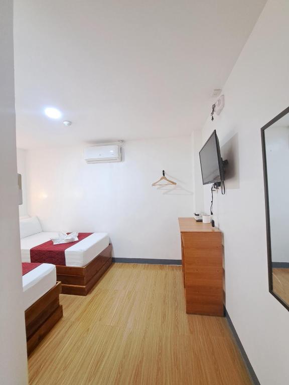 TV a/nebo společenská místnost v ubytování Virginia Suites