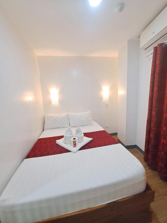 Postel nebo postele na pokoji v ubytování Virginia Suites
