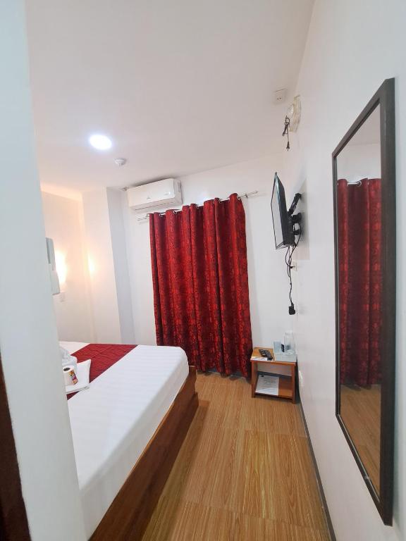 Postel nebo postele na pokoji v ubytování Virginia Suites