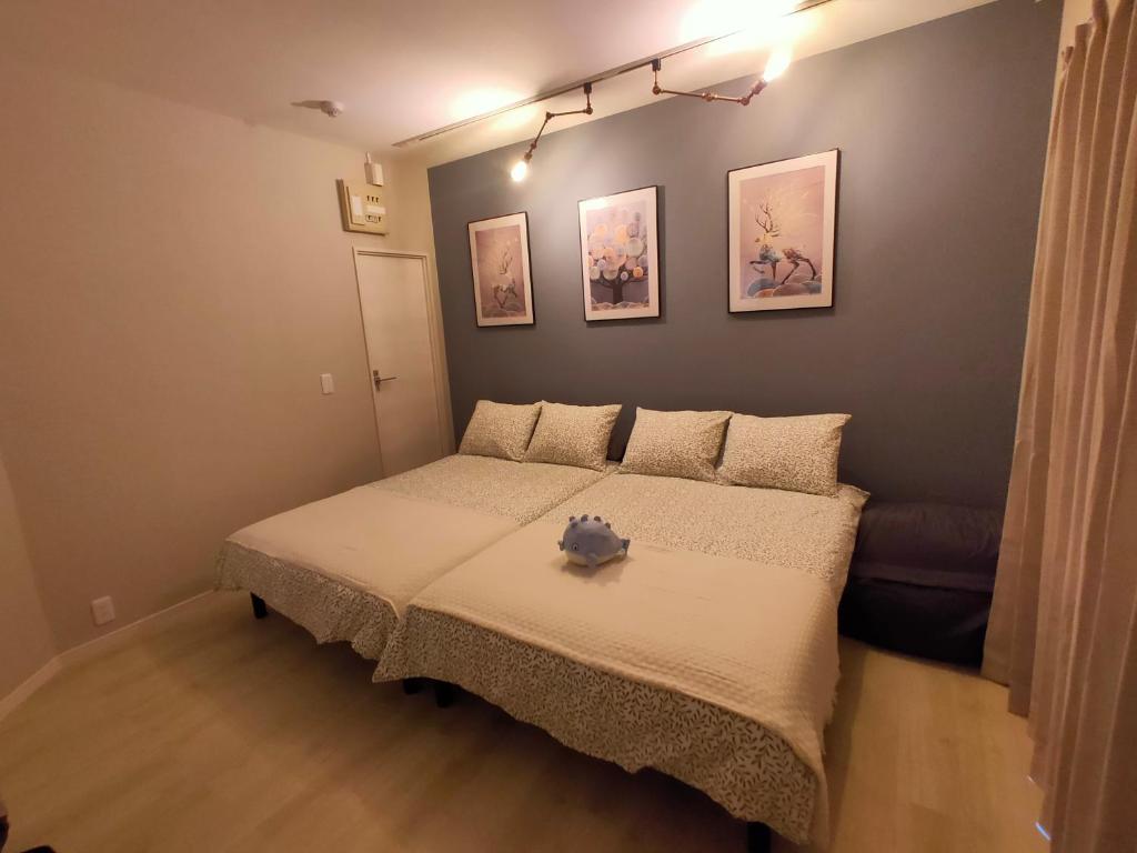 Postel nebo postele na pokoji v ubytování 豆インMaMe Inn