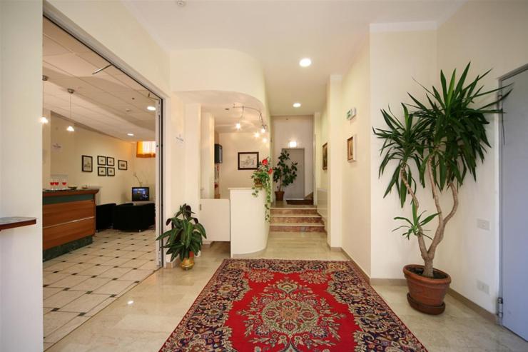 an office hallway with a red rug on the floor at Il Centrale in Cortona