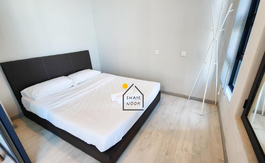 Postel nebo postele na pokoji v ubytování JQ KK Homestay#7 by ShamNook