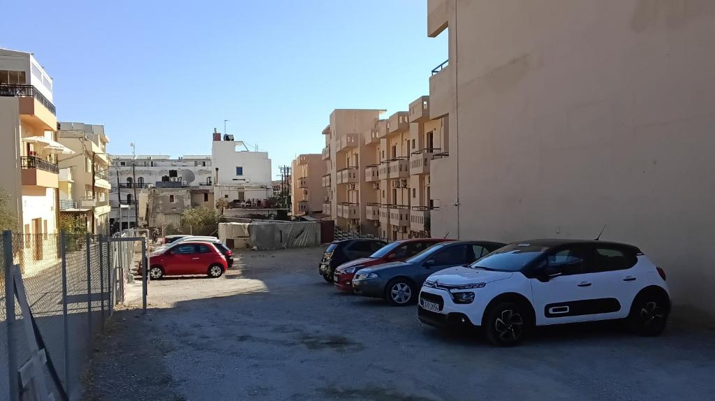 a group of cars parked in a parking lot at Thalia deco City & Beach Hotel in Hersonissos