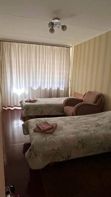 Postel nebo postele na pokoji v ubytování Apartment on Karja