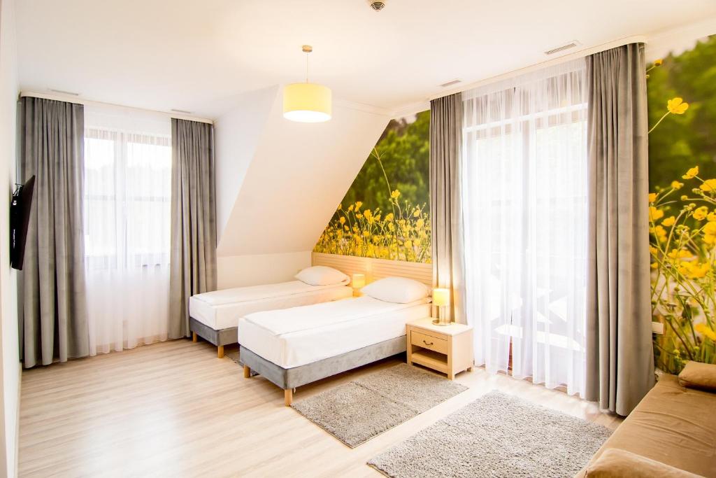Posteľ alebo postele v izbe v ubytovaní Hotel Barczyzna Medical Spa