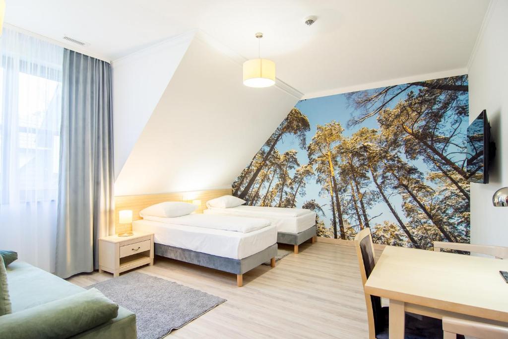 Posteľ alebo postele v izbe v ubytovaní Hotel Barczyzna Medical Spa