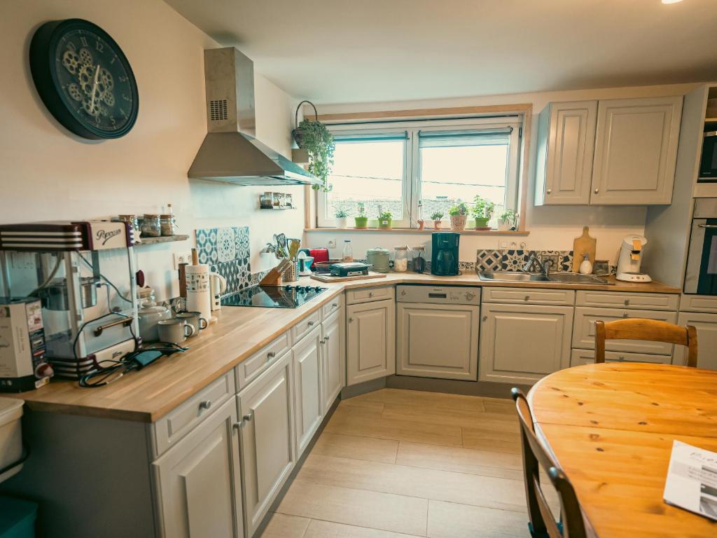 Kuchyň nebo kuchyňský kout v ubytování Appartement SPA VIP Pont Alsort