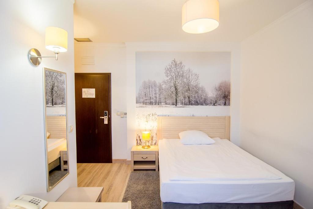 Posteľ alebo postele v izbe v ubytovaní Hotel Barczyzna Medical Spa