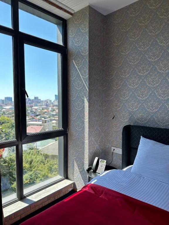Postel nebo postele na pokoji v ubytování 10inn Boutique Hotel