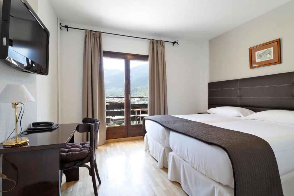 Postel nebo postele na pokoji v ubytování Hotel Blu Aran