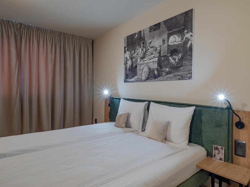 Una cama o camas en una habitación de Craft Inn - Boutique Hotel