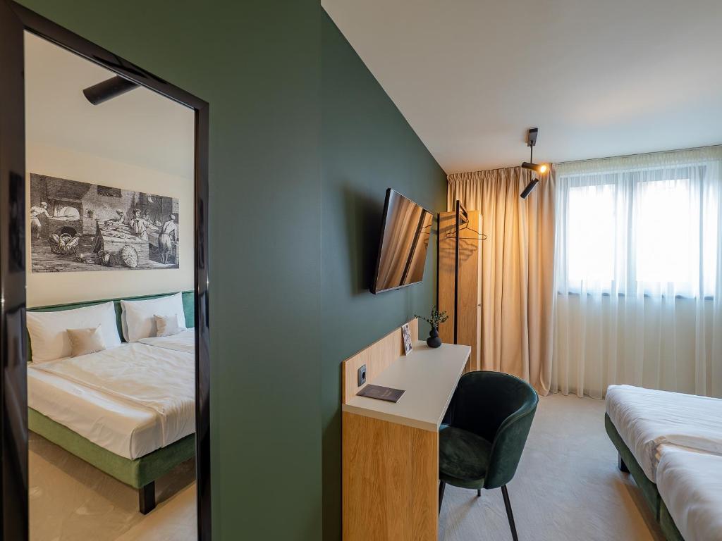 Una cama o camas en una habitación de Craft Inn - Boutique Hotel