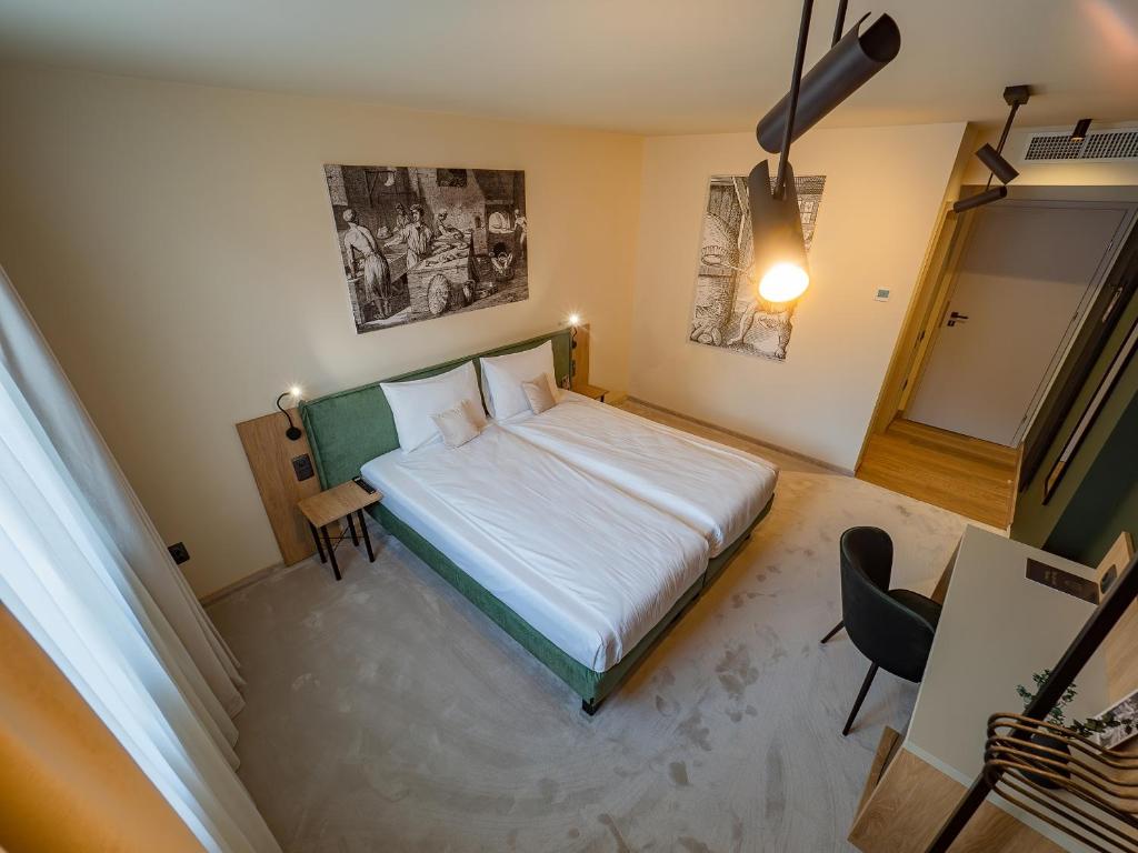 Una cama o camas en una habitación de Craft Inn - Boutique Hotel