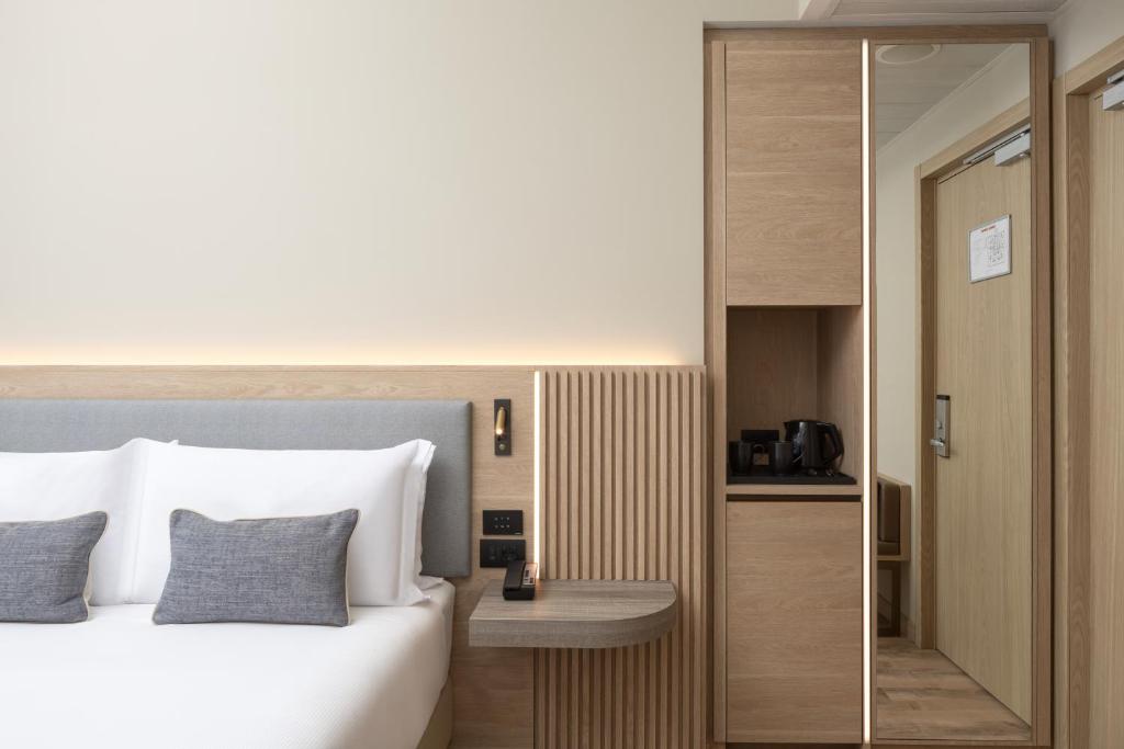 Кровать или кровати в номере Courtyard by Marriott Milano Linate