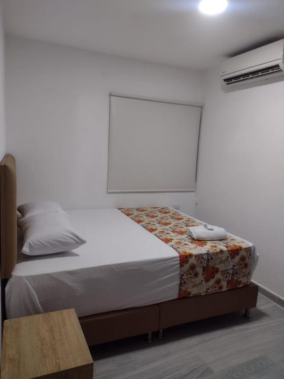 Postel nebo postele na pokoji v ubytování Hotel Brisas MEDELLIN