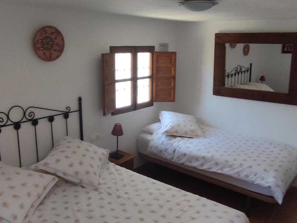 Postel nebo postele na pokoji v ubytování B&B Cortijo Loma León
