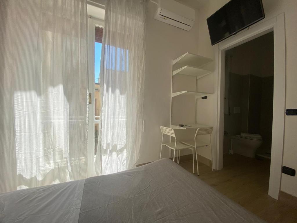 Postel nebo postele na pokoji v ubytování B&B 10 mt dal duomo
