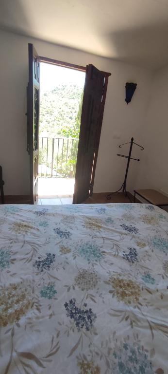 Postel nebo postele na pokoji v ubytování B&B Cortijo Loma León