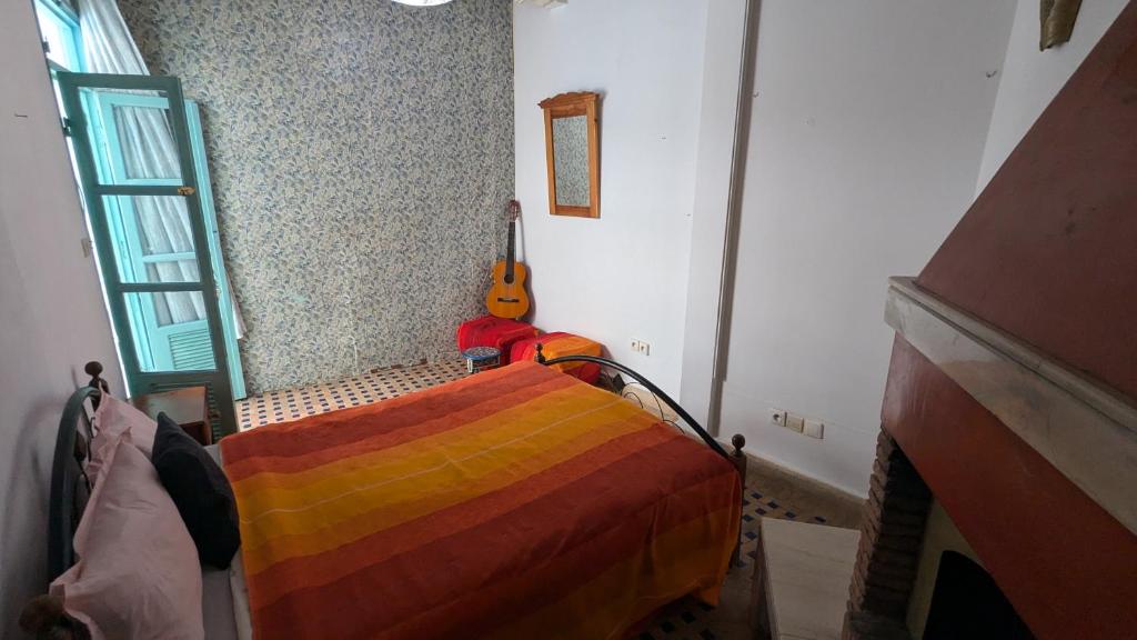 Postel nebo postele na pokoji v ubytování Riad Dar