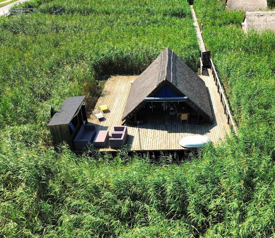 an overhead view of a house in a field at Mountains and Lakes - Romantika 5 Beach Bungalow in Rust