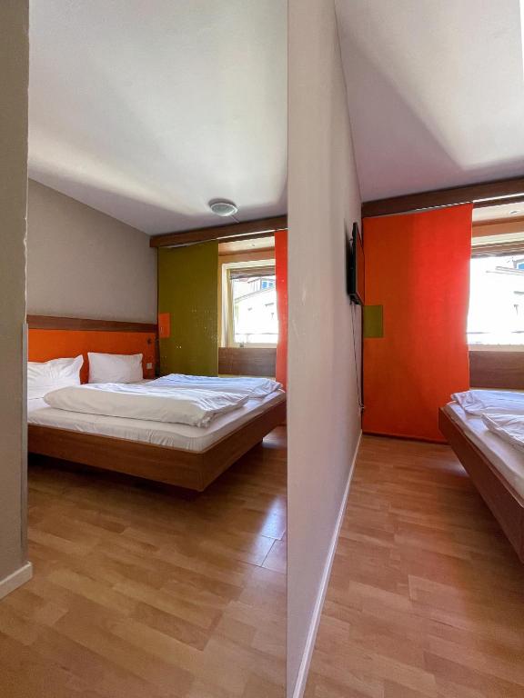Postel nebo postele na pokoji v ubytování Hotel Sendlinger Tor