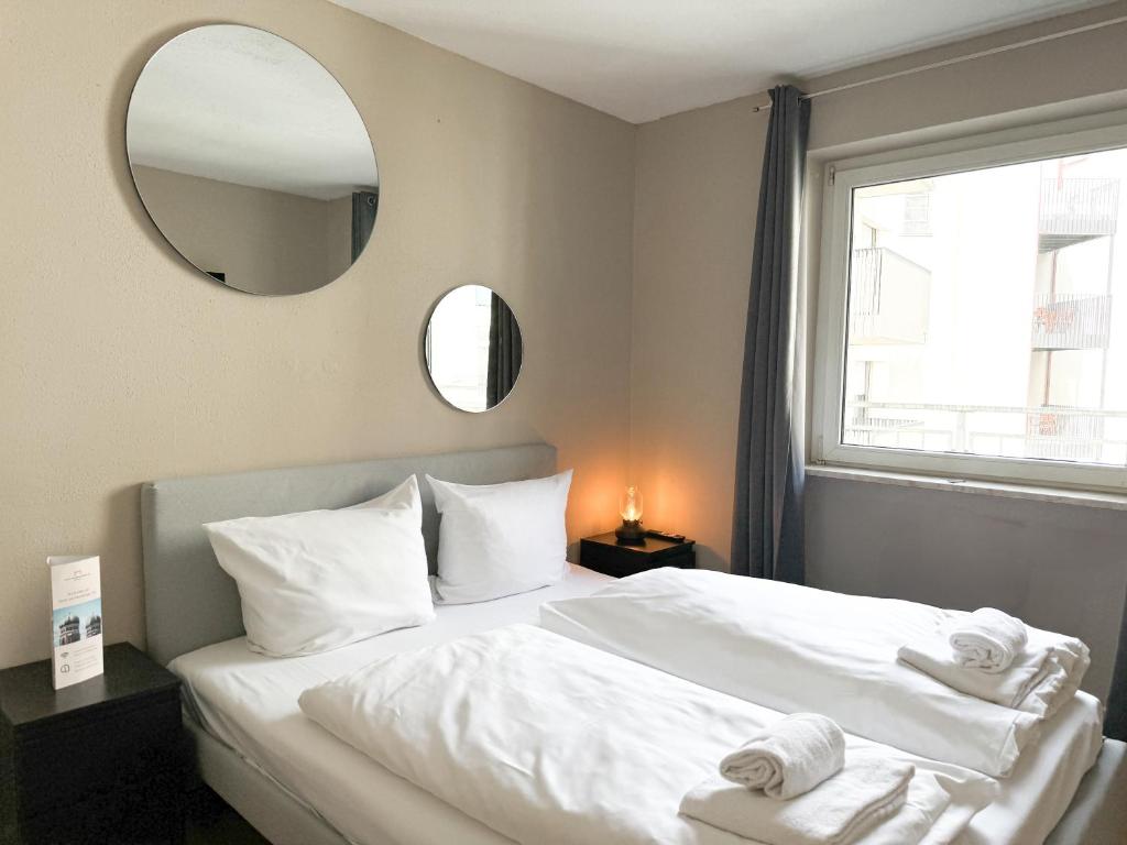 Postel nebo postele na pokoji v ubytování Hotel Sendlinger Tor