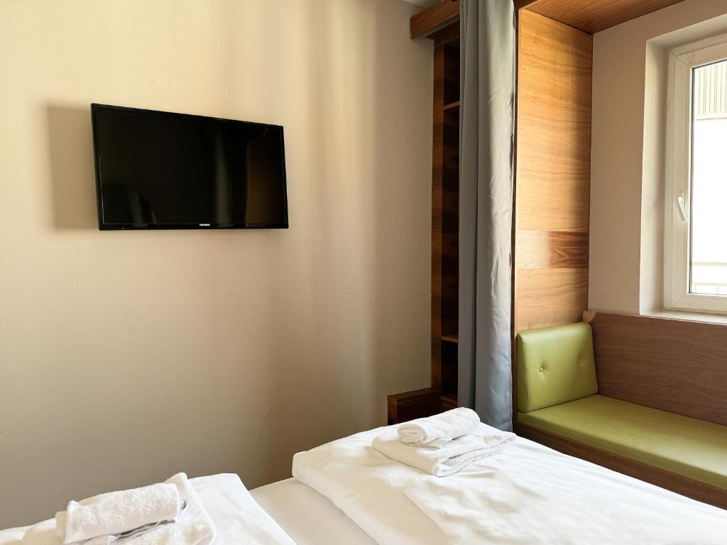 Postel nebo postele na pokoji v ubytování Hotel Sendlinger Tor