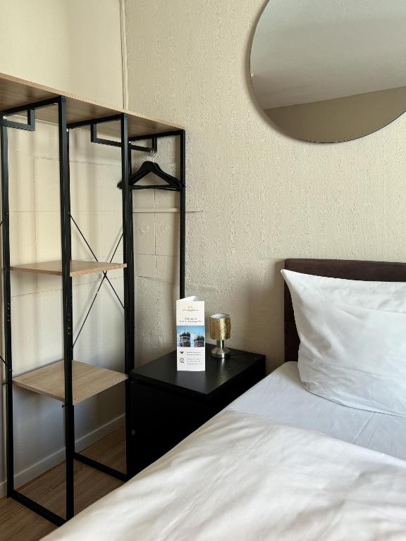 Postel nebo postele na pokoji v ubytování Hotel Sendlinger Tor