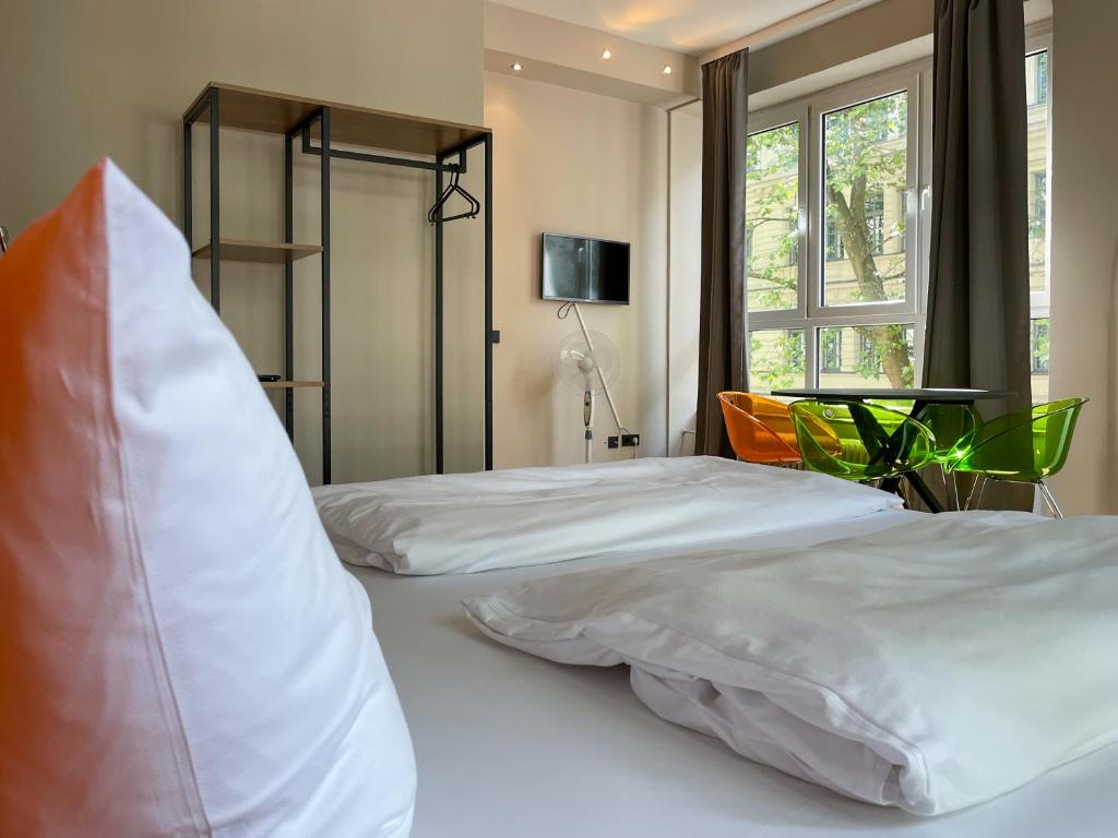 Postel nebo postele na pokoji v ubytování Hotel Sendlinger Tor