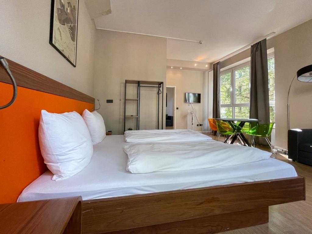 Postel nebo postele na pokoji v ubytování Hotel Sendlinger Tor