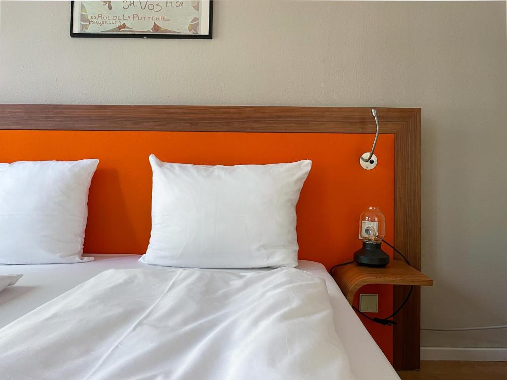 Postel nebo postele na pokoji v ubytování Hotel Sendlinger Tor