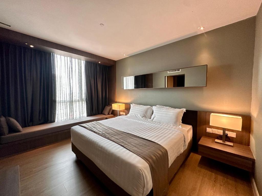 Postel nebo postele na pokoji v ubytování Swiss-Garden Hotel Melaka