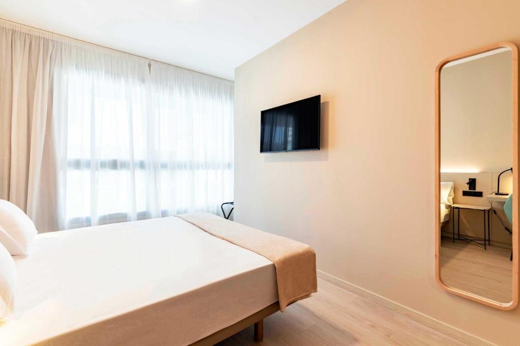 TV a/nebo společenská místnost v ubytování HQ Arena Hotel