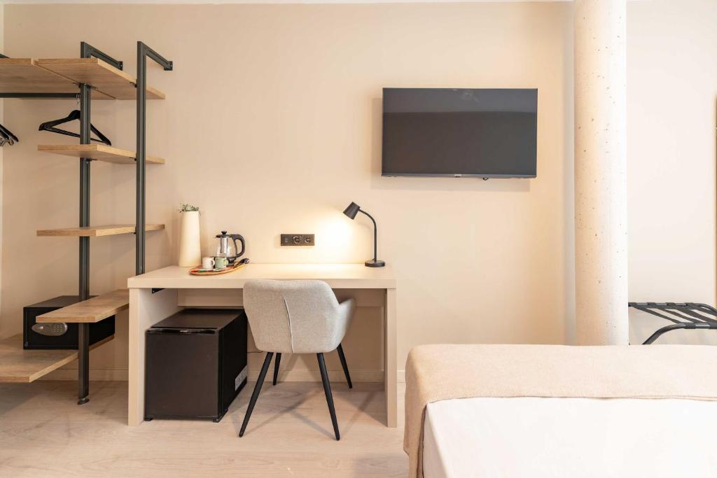 Postel nebo postele na pokoji v ubytování HQ Arena Hotel