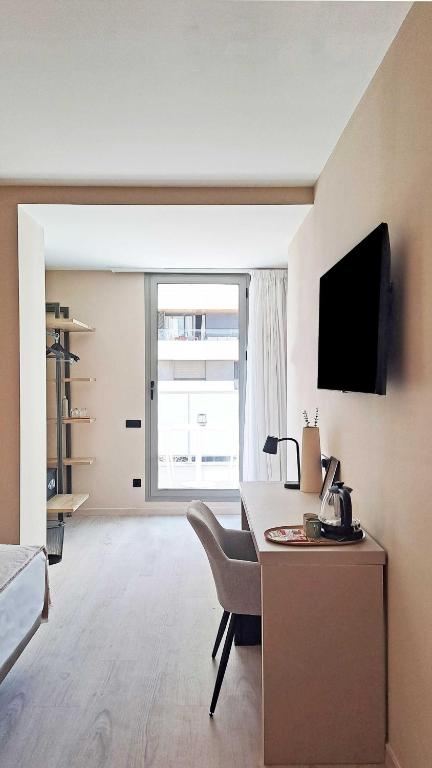 TV a/nebo společenská místnost v ubytování HQ Arena Hotel