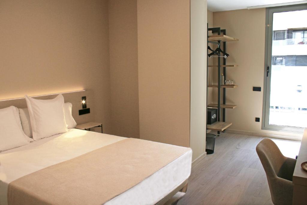Postel nebo postele na pokoji v ubytování HQ Arena Hotel