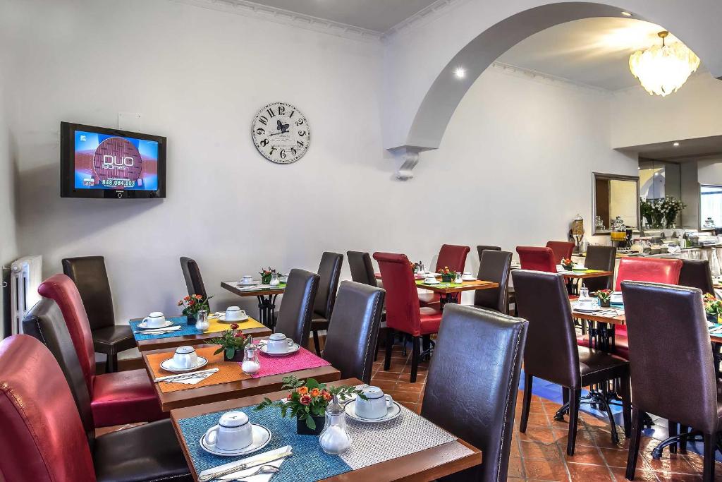 TV a/nebo společenská místnost v ubytování Hotel Caracciolo