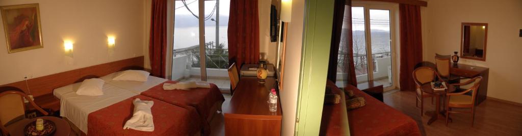 Postel nebo postele na pokoji v ubytování Hotel Kiani Akti