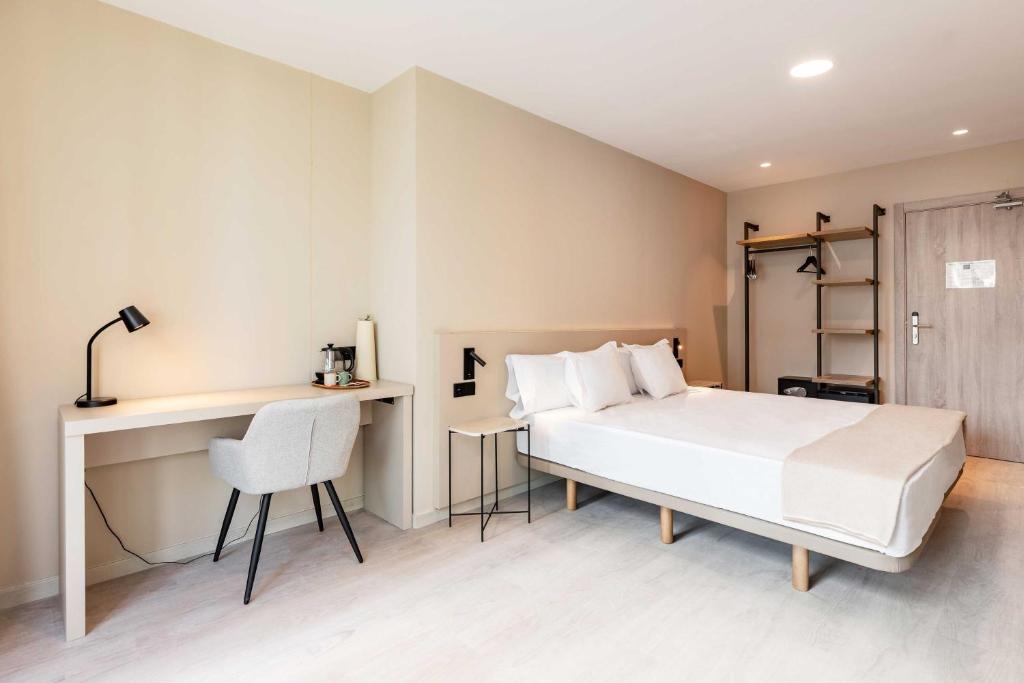 Postel nebo postele na pokoji v ubytování HQ Arena Hotel