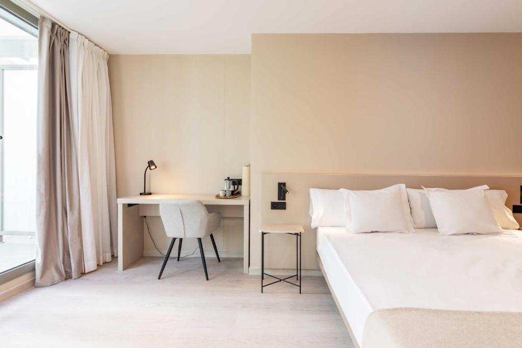 Postel nebo postele na pokoji v ubytování HQ Arena Hotel