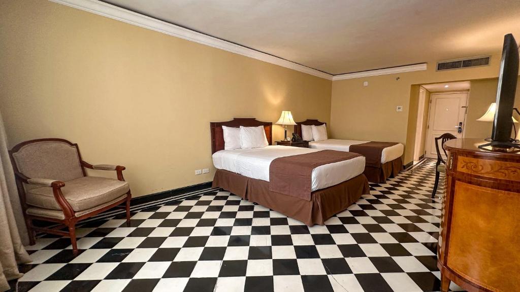 Uma cama ou camas num quarto em Hotel El Prado