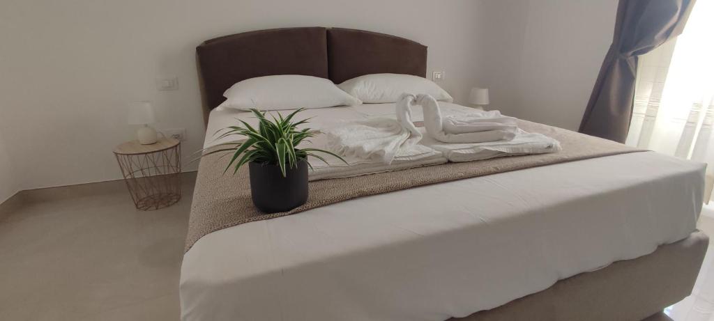 Postel nebo postele na pokoji v ubytování FeVi Rooms