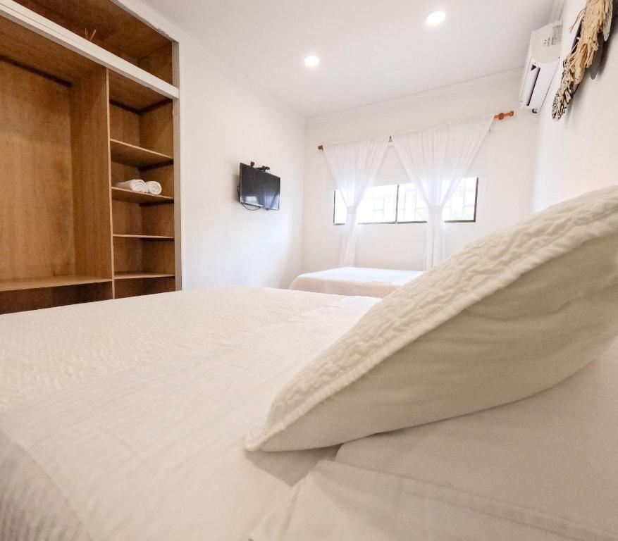 Postel nebo postele na pokoji v ubytování Puesta del Sol Guest House
